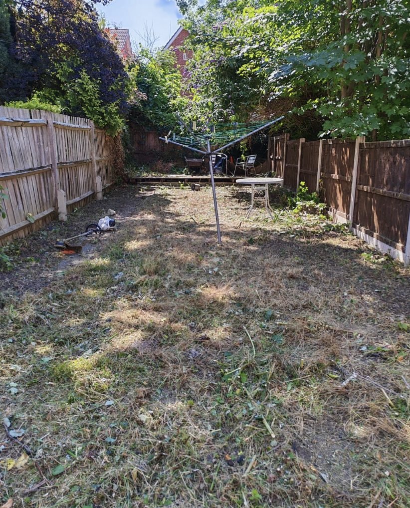 A back garden strimmed down after being left to grow over